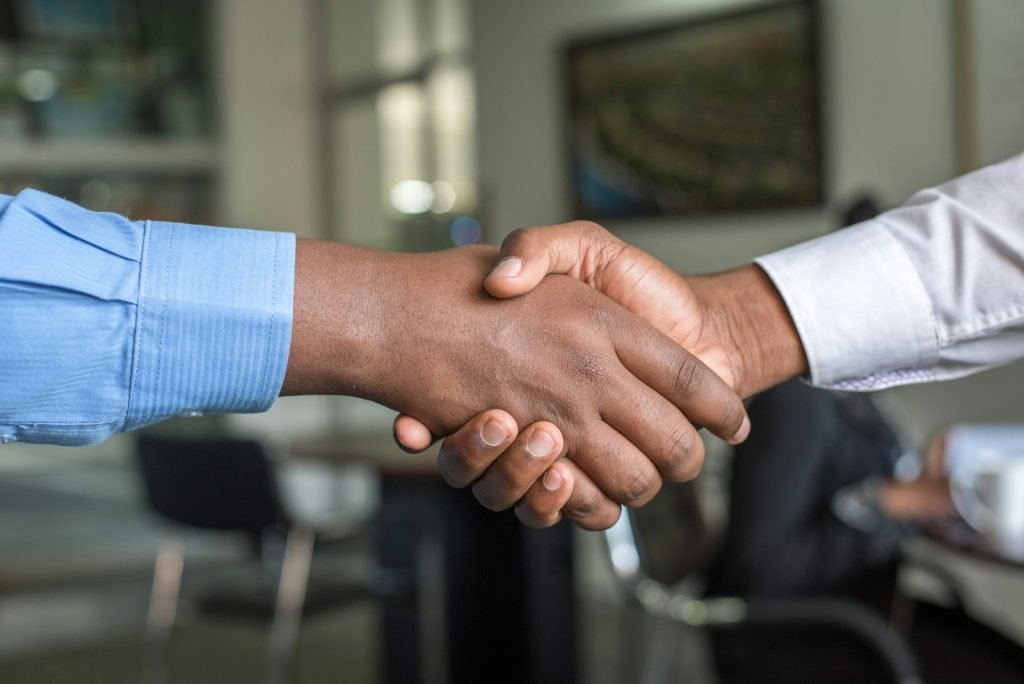 Insurance agent shaking hands with a client