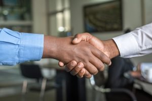 Insurance agent shaking hands with a client